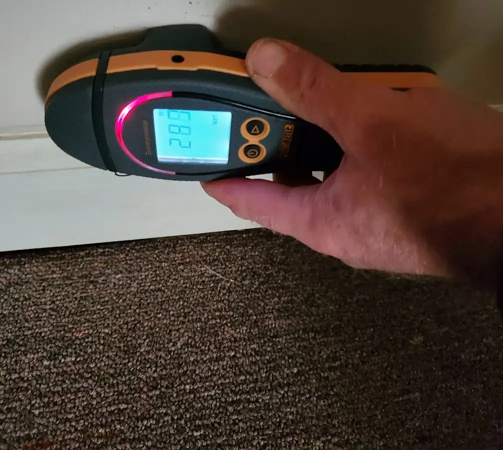 Moisture detection at baseboard during Storm Damage Restoration in Irvine